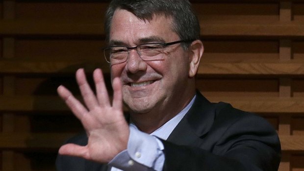 US Defence Secretary Ash Carter waves in Stanford, California where he delivered his 'Rewiring the Pentagon: Charting a New Path on Innovation and Cybersecurity' on Thursday.