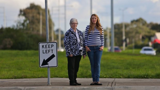 Whittlesea residents Lynn Ansell and Alahna Desiato at the intersection of Plenty Road and Bush Boulevard in Mill Park, where the wide median strip was built for a tram line that has not yet been built.
