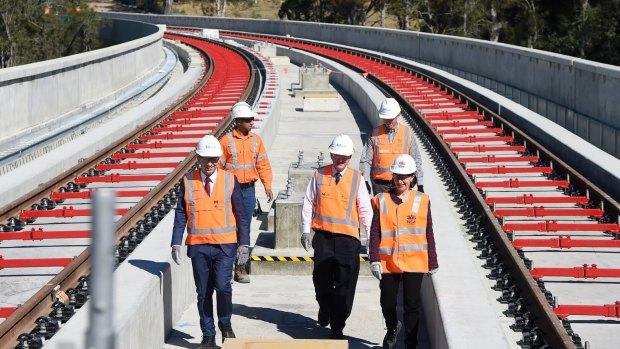 Premier Gladys Berejiklian, right, and Transport Minister Andrew Constance tour the Skytrain viaduct at Rouse Hill.