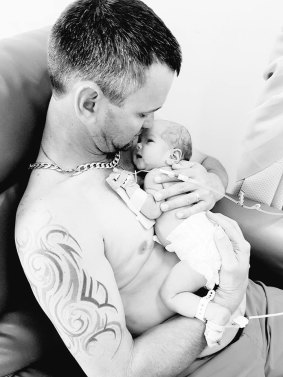 Glynn Sheppard with his newborn daughter, Willa.