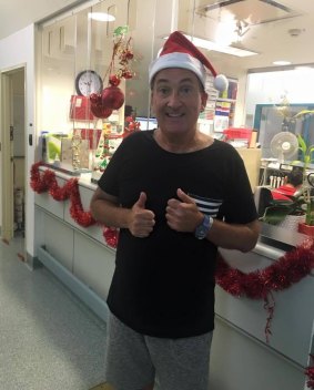 Glenn Wheeler donned a Santa hat as he left hospital. 