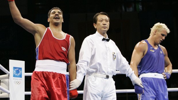 Australian boxer Adam Forsyth, right, after losing the heavyweight boxing quarter finals in the 2004 Athens Summer Olympic Games.