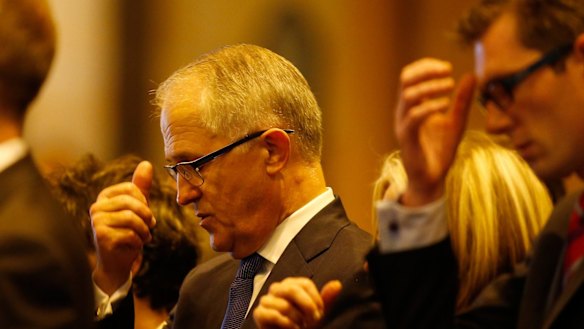 Australian Minister of Communications Malcolm Turnbull attends a mass to pay respect to the victims of the Martin Place siege.