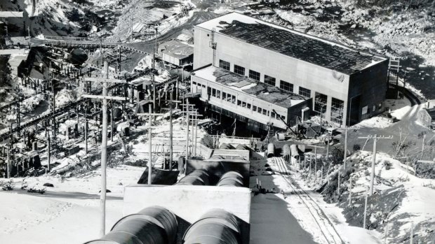 Guthega power station, the first of 17 power stations to be built in the Snowy Mountains. Down through these huge steel penstock pipes, water from the three and a quarter mile Guthega-Munyang tunnel rushes down to the turbines of the power station. 