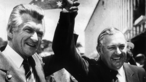 Alan Bond with Bob Hawke celebrating the America's Cup win.
