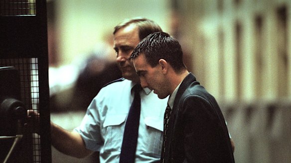 Jason Roberts is led out of the Supreme Court in 2002.