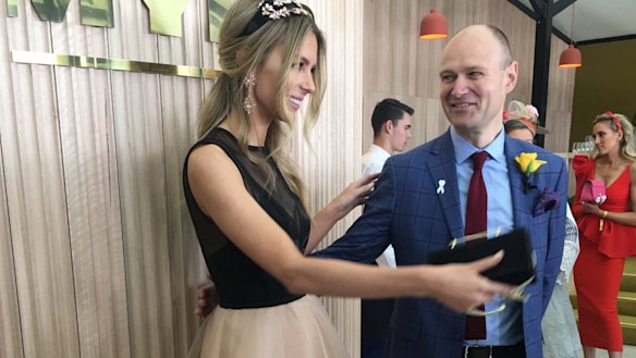 Partying as the enemy arrived: Myer CEO Richard Umbers with Jennifer Hawkins on Cup Day.