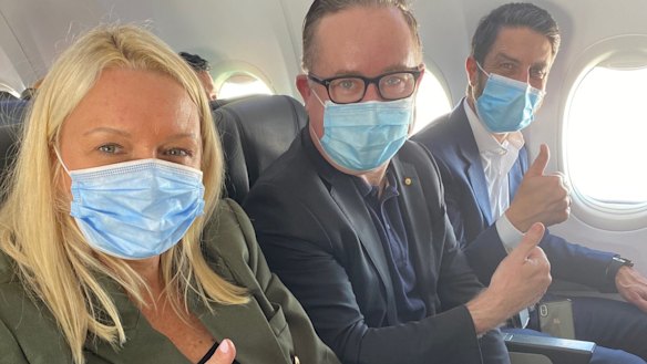 Qantas chief Alan Joyce wears a face mask on board a flight last month.