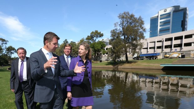 Former Parramatta mayor Paul Garrard (left), pictured with then NSW premier Mike Baird last year opposite the proposed site of the new Powerhouse Museum.