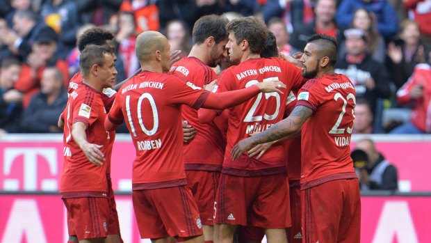 Bayern's players celebrate a goal.