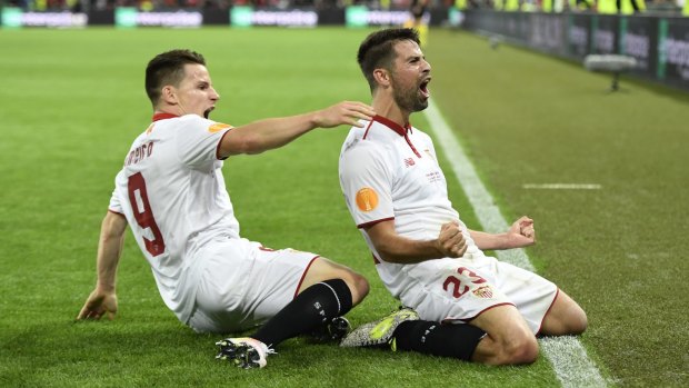 Sevilla's Coke, right, celebrates with Kevin Gameiro after scoring his second goal.