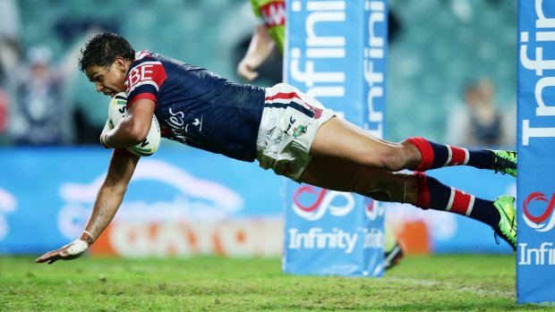 Roosters rookie Latrell Mitchell crosses.