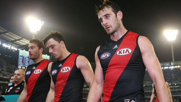 Michael Hibberd (centre) has told Essendon he wants to leave.