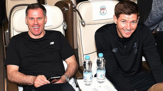 All smiles: Jamie Carrager and Steven Gerrard settle in for the flight.