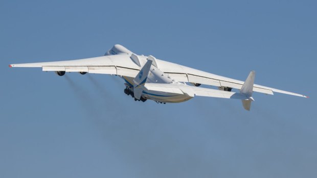 One weird facet of the Antonov is the enormously wide twin tail. Mounting a large object on top of the fuselage distorts the flow of air to the tail elevators and rudder on a single-tail aircraft, but the twin-tail design gets around this problem.
