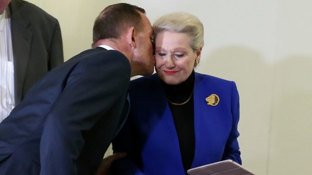 Former prime minister Tony Abbott kisses former speaker Bronwyn Bishop after she was dumped from the speakership in August. 