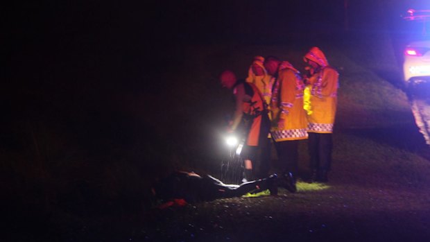 Emergency services personnel search drains at the park.