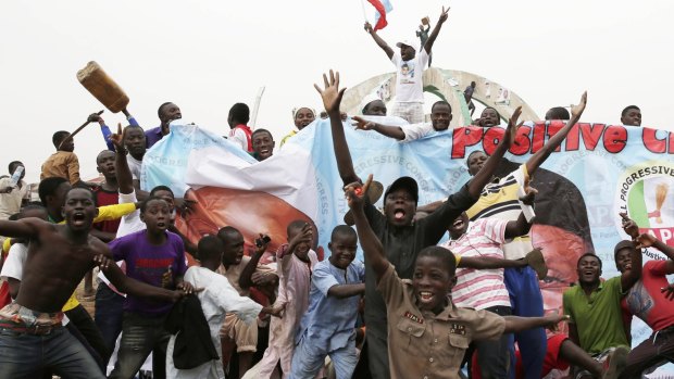 Residents celebrate the presidential victory of Muhammadu Buhari in Kaduna, Nigeria.