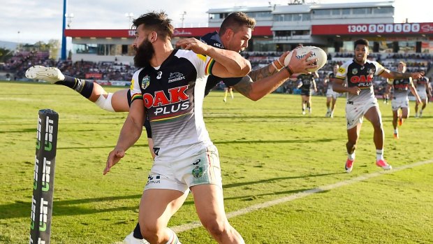 Acrobatics: Kyle Feldt of the Cowboys catches a high ball to score a try against Penrith at 1300SMILES Stadium on Saturday.