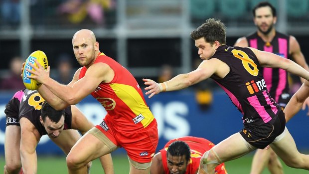 Best on ground: Gary Ablett of the Suns breaks free.