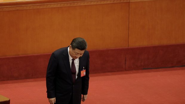 Xi Jinping bows after delivering his speech at the opening of the 19th National Congress