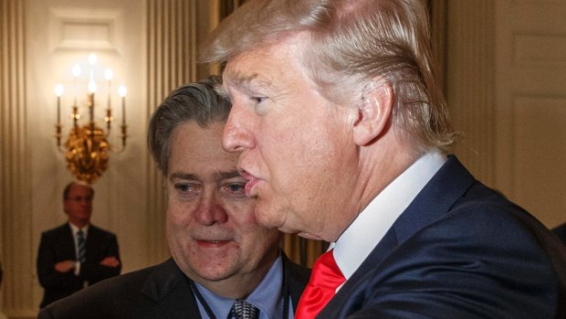 US President Donald Trump and then-White House chief strategist Steve Bannon in the State Dining Room of the White House in Washington in February. 