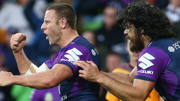 Blake Green of the Storm celebrates a try against the Brisbane Broncos on June 21,