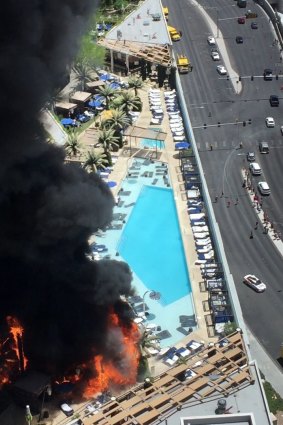 Smokes billows from a fire on the outside pool area of the Cosmopolitan of Las Vegas hotel-casino.