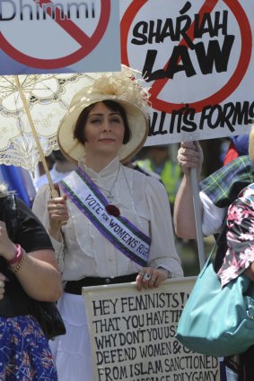 Arabella McKenzie protests dressed as a suffragete,