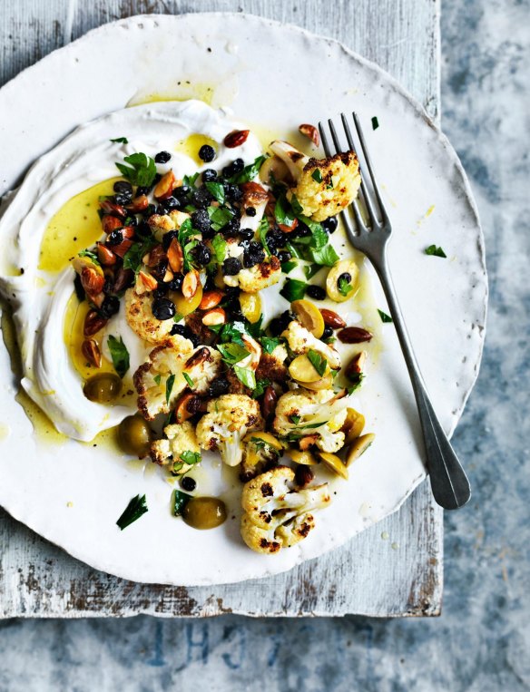 A swoosh of labna topped with olive oil and roasted cauliflower.