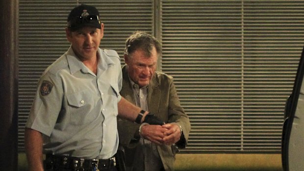 Murderer Ian Turnbull is escorted out of court during the trial.