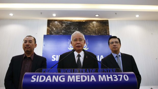 Malaysian Prime Minister Najib Razak, centre, speaks at a special press conference announcing the findings for the ill fated flight MH370 in Kuala Lumpur, Malaysia, early on Thursday.