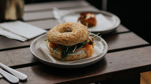 Bagels are filled with smoked salmon and cream cheese or pastrami and crisp potato straws.