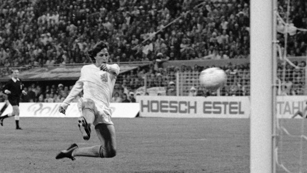 Johan Cruyff jumps to hit the ball into the net for his team's second goal against Brazil in their World Cup match in 1974. 