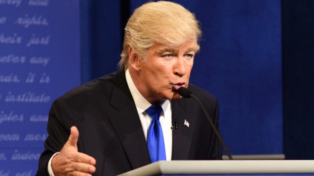 This Oct. 1, 2016 photo released by NBC shows Alec Baldwin portraying Republican presidential candidate Donald Trump during a sketch on "Saturday Night Live," in New York. Trump's response on Twitter was, "Alec Baldwin portrayal stinks.? (Will Heath/NBC via AP)