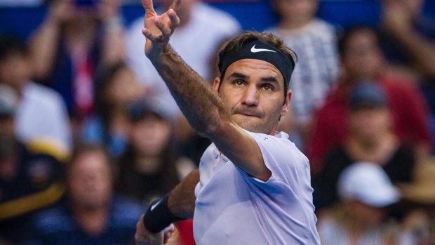 Getting hie eye in: Roger Federer raised his game after a slow beginning against Yuichi Sugita.
