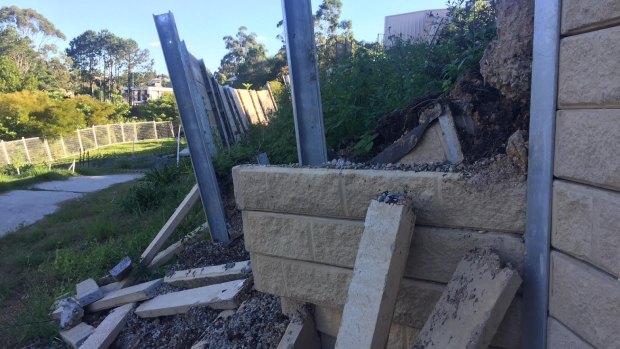 Police lay fraud charges after questions over collapsing retaining walls.