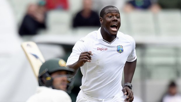 Jubilant: West Indies seamer Carlos Brathwaite reacts after bowling to Australia's Joe Burns.