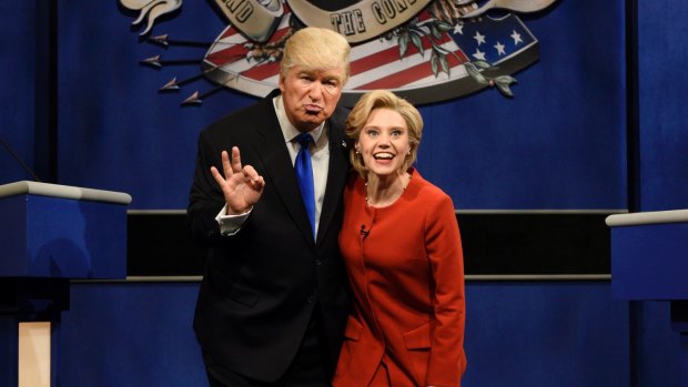 It wasn't meant to be Donald Trump in office, says Alec Baldwin as he continues his spoof on SNL with Kate McKinnon as Hillary Clinton.
