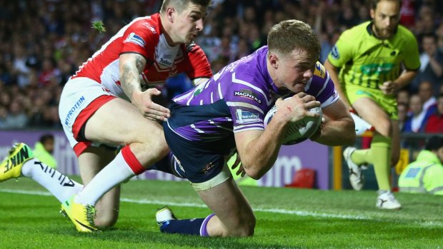 On the ball: Roosters' recruit Joe Burgess scoring the opening try of the Super League grand final for Wigan.