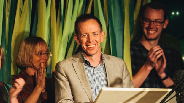 Shane Rattenbury, with Caroline Le Couteur, left, speaks at the Greens election party.