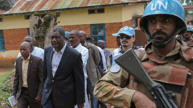 Campaigner: surgeon Denis Mukwege (second left) with United Nations bodyguards at the Panzi Hospital, near the border with Rwanda in the Democratic Republic of Congo.