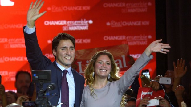 Liberal leader Justin Trudeau waves with his wife Sophie Gregoire in Montreal last year. 