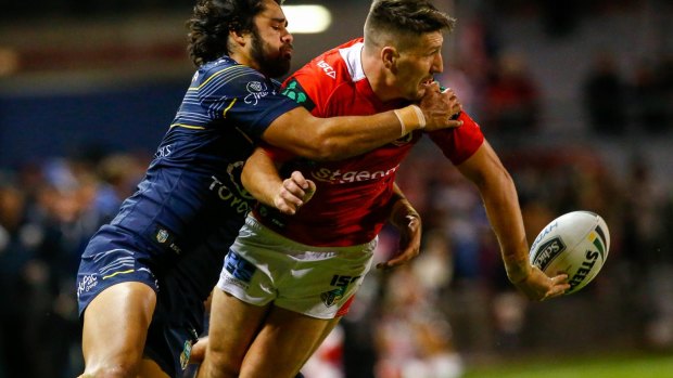 Making the extra man: Gareth Widdop gets one away in the tackle.