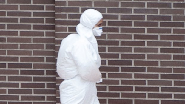 Protected: A member of a sanitation team is dressed to avoid contact with Ebola victims.
