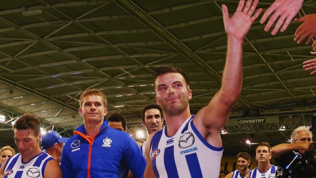 Luke McDonald (right) has signed a contract extension with North Melbourne.