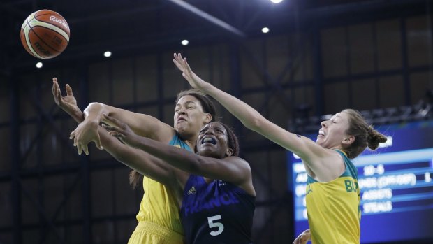 France forward Endy Miyem (5) has the ball knocked away by Australian centre Liz Cambage, left, during the first half .