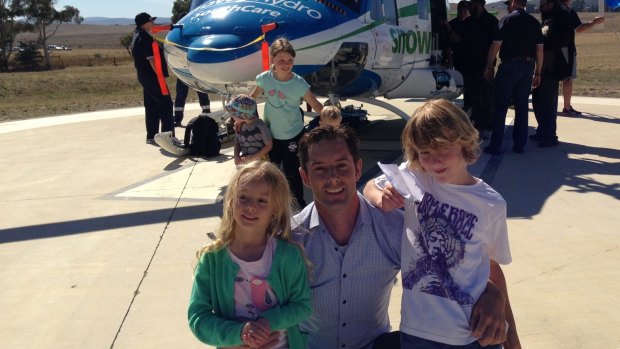 New Snowy Hydro SouthCare helicopter chief executive Chris Kimball with his children Violet and Noah.