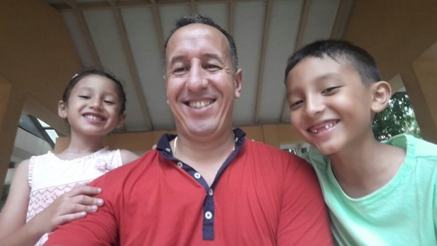 Family man: Moroccan coach Karim Bencherifa with his kids, Rania and Adam in Singapore.