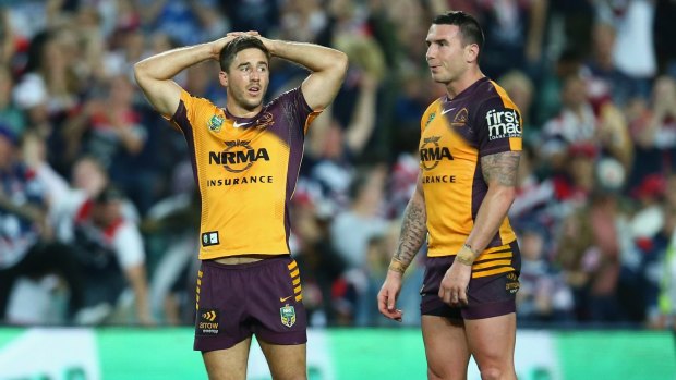 Ben Hunt and Darius Boyd of the Broncos look dejected after defeat during the round 24 match against the Roosters.